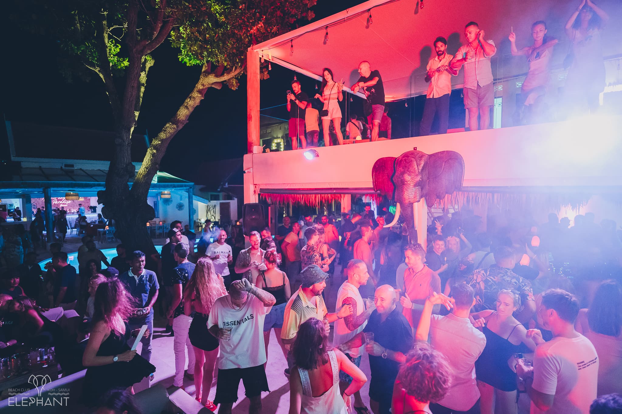 A vibrant night at Elephant Beach Club, the lit elephant sculpture above the crowd on Chaweng Beach, Koh Samui