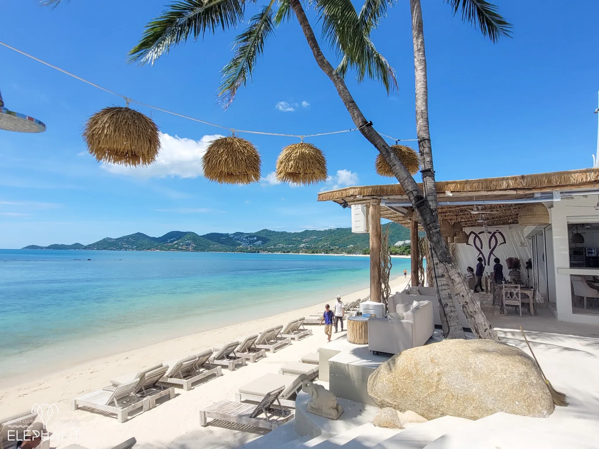 Elephant boutique resort's beachfront terrace on Chaweng Beach, Koh Samui, at golden hour