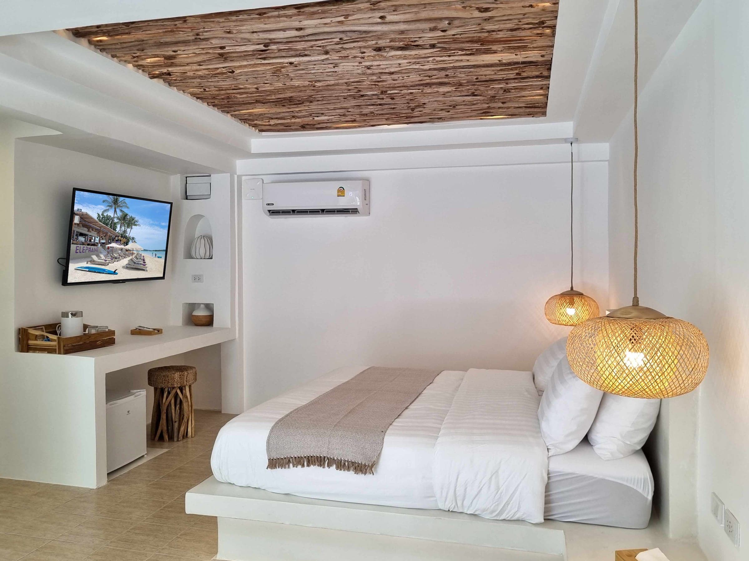 The Luxe Bungalow interior with its desk nook and driftwood ceiling at Elephant Beach Resort