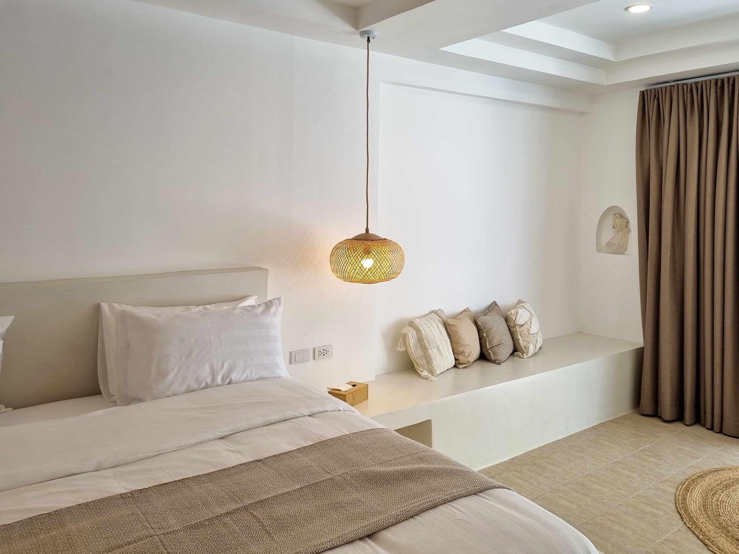 Wide bed with a bench and cushions in the Luxe Bungalow, Chaweng Beach