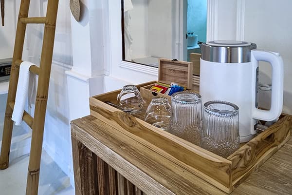 Coffee and tea tray with kettle and glasses in the Robinson Bungalow, Elephant Beach Resort