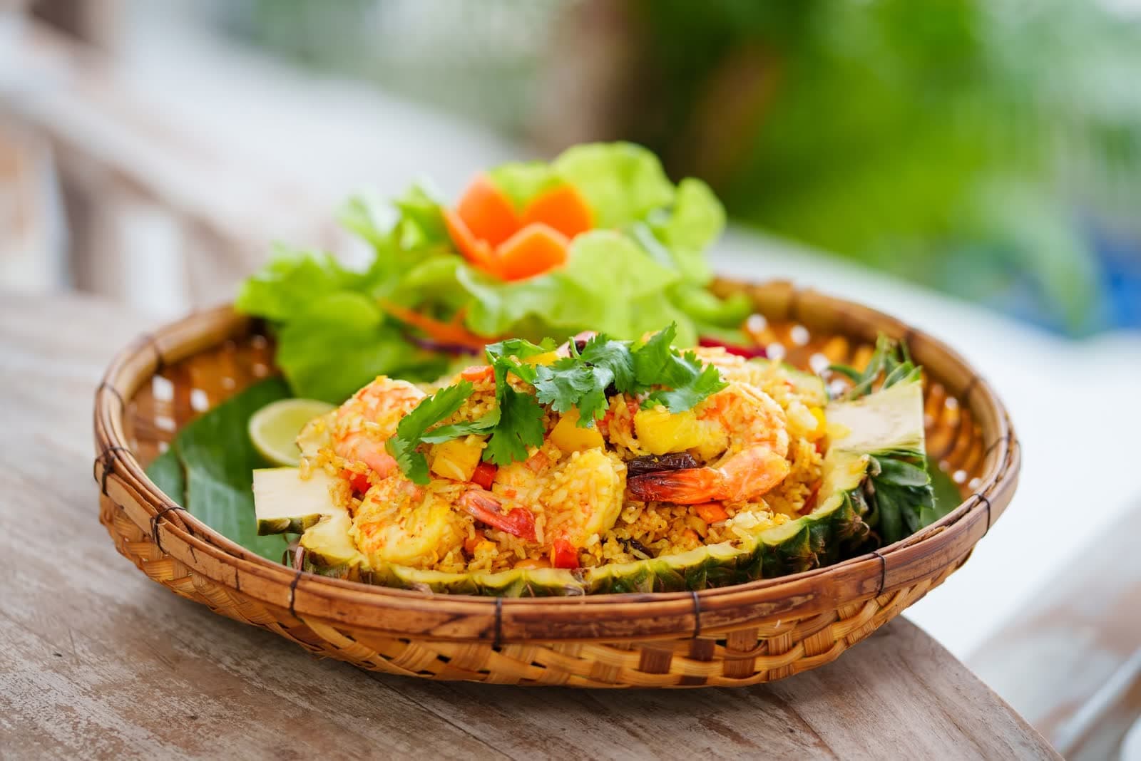 Pineapple fried rice with prawns served in a woven basket at Elephant beachfront restaurant, Koh Samui