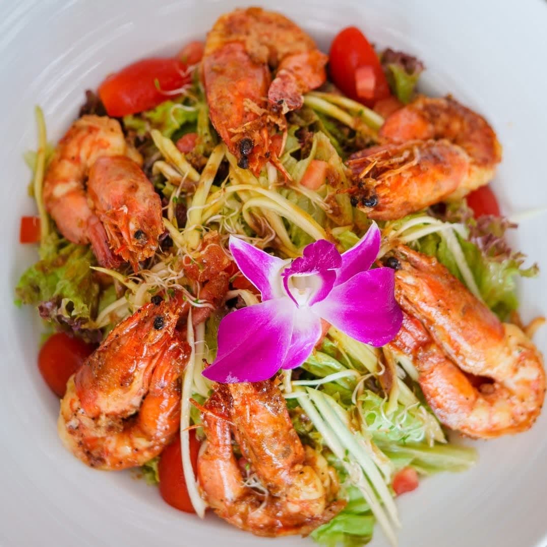 Prawn and green mango salad topped with an orchid at Elephant, Chaweng Beach, Koh Samui